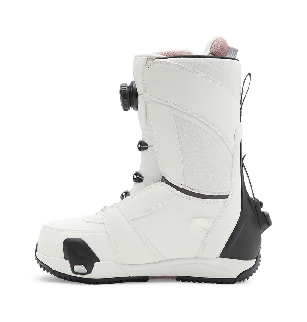 Women’s Lotus Step On® Snowboard Boot by DC Shoes in white, with a black sole and heel, shown from the left side against a plain white background. Features include the Dual Zone BOA Fit System lacing and a rear pull tab.