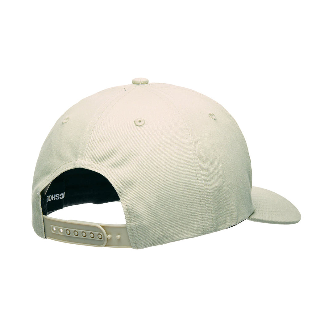 The DC Shoes Legacy Star Snapback is shown from the back in light beige, highlighting its adjustable snapback closure and visible stitching on the twill fabric.