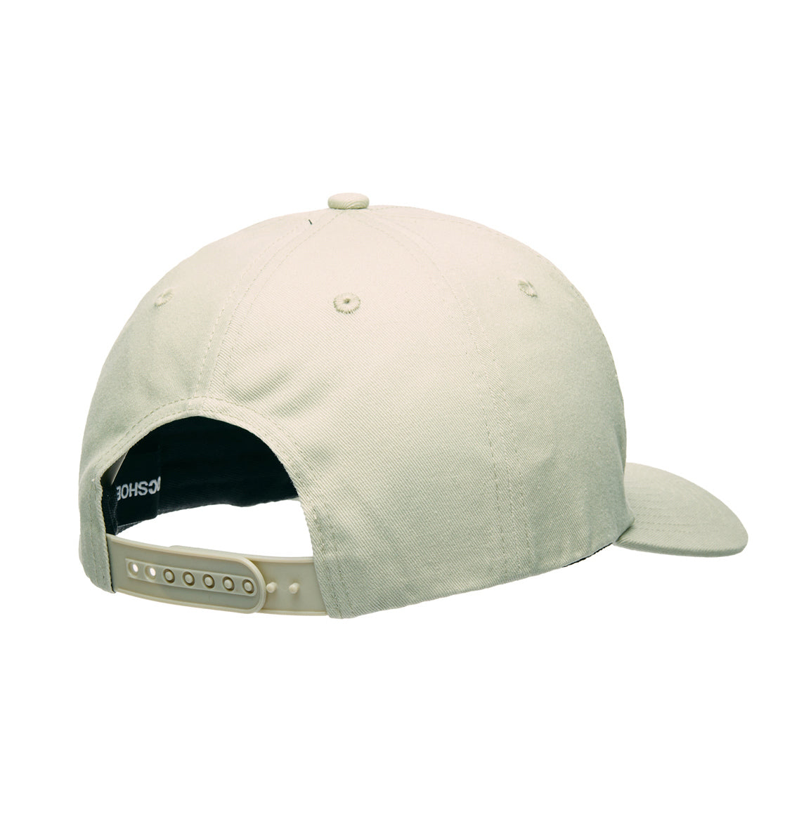 The DC Shoes Legacy Star Snapback is shown from the back in light beige, highlighting its adjustable snapback closure and visible stitching on the twill fabric.