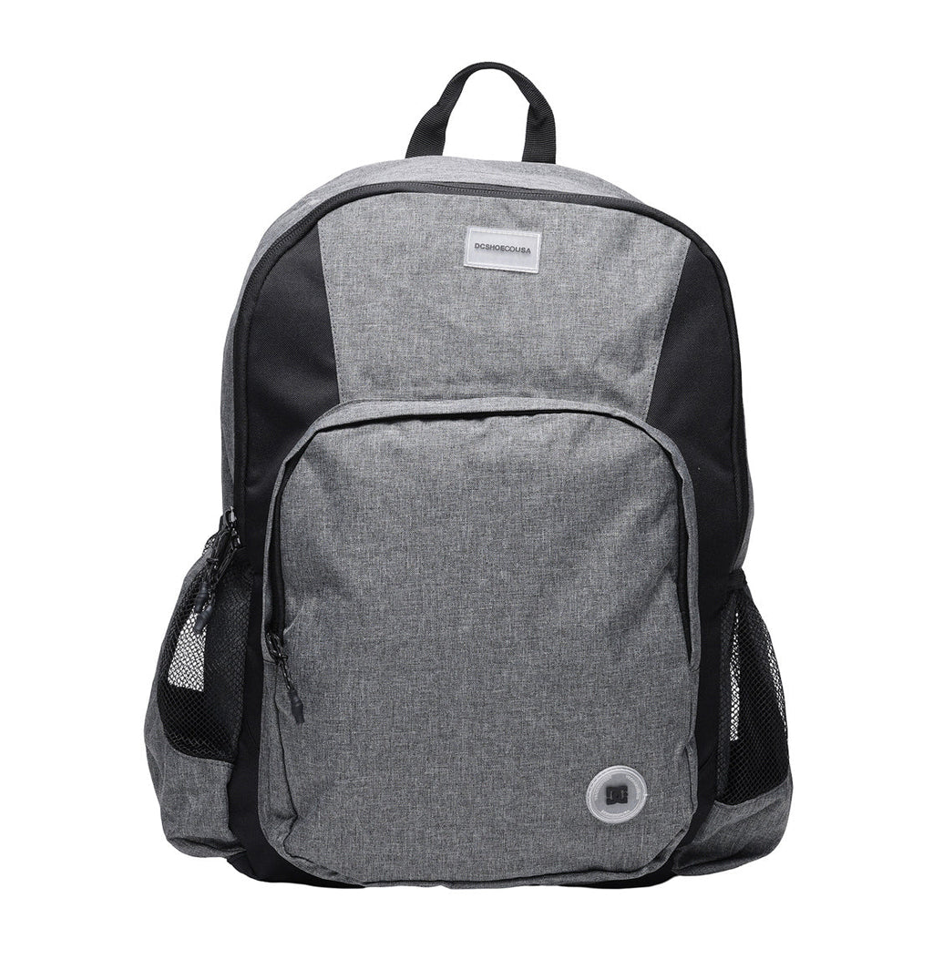 The DC Shoes Locker Backpack in gray and black features a front pocket, mesh side pockets, a top handle, and a small circular port near the bottom right of the front pocket. Inside, it includes a padded laptop sleeve to keep your device secure and organized.