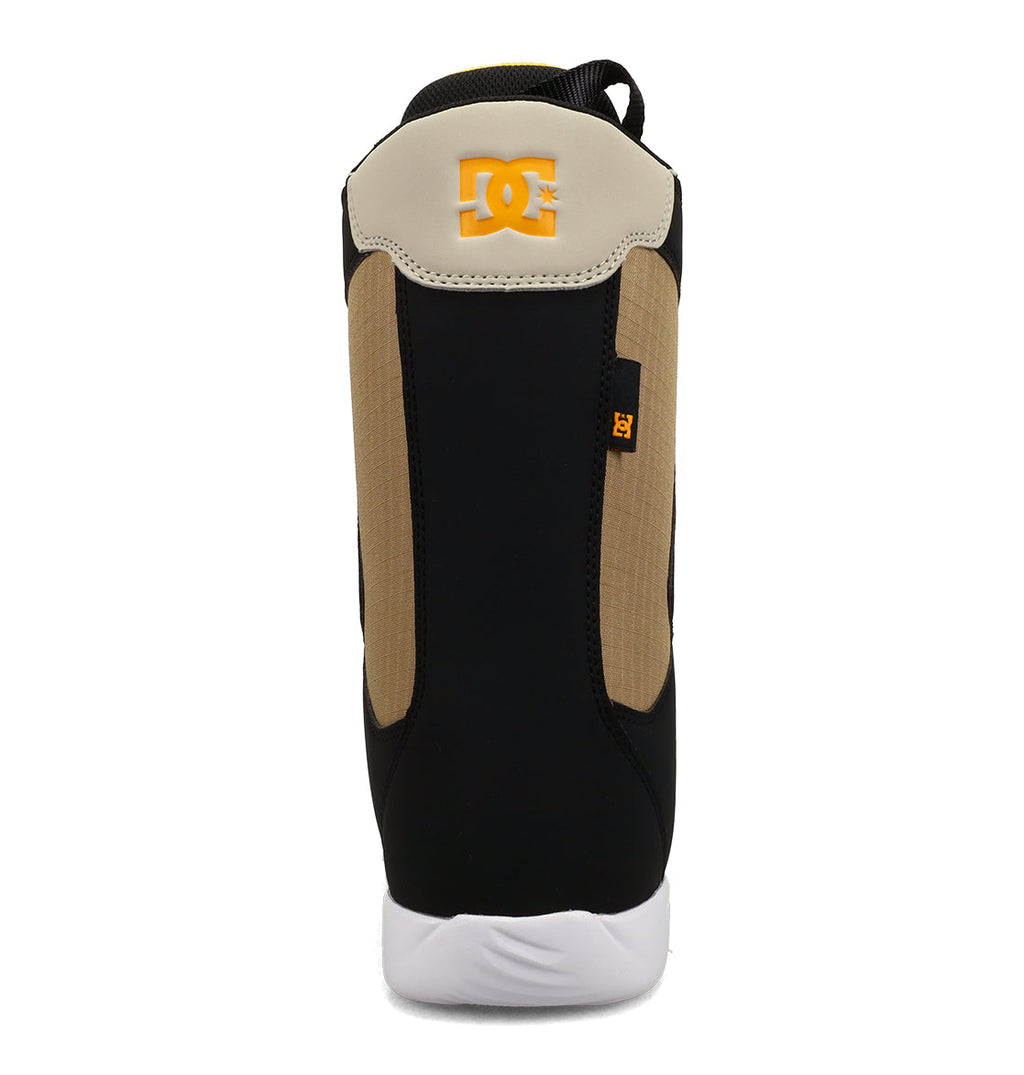 A rear view of the DC Shoes Men’s Phase Boa Snowboard Boots showcases a tan, black, and white color scheme. The orange DC logo appears on the heel, while the white sole highlights a stylish design reminiscent of performance snowboard boots.