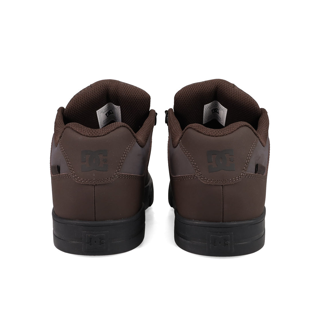 A pair of brown DC Shoes Men's Pure Shoes are shown from the back, displaying black soles and the DC logo on the heel tabs—ideal for daily comfort and style.