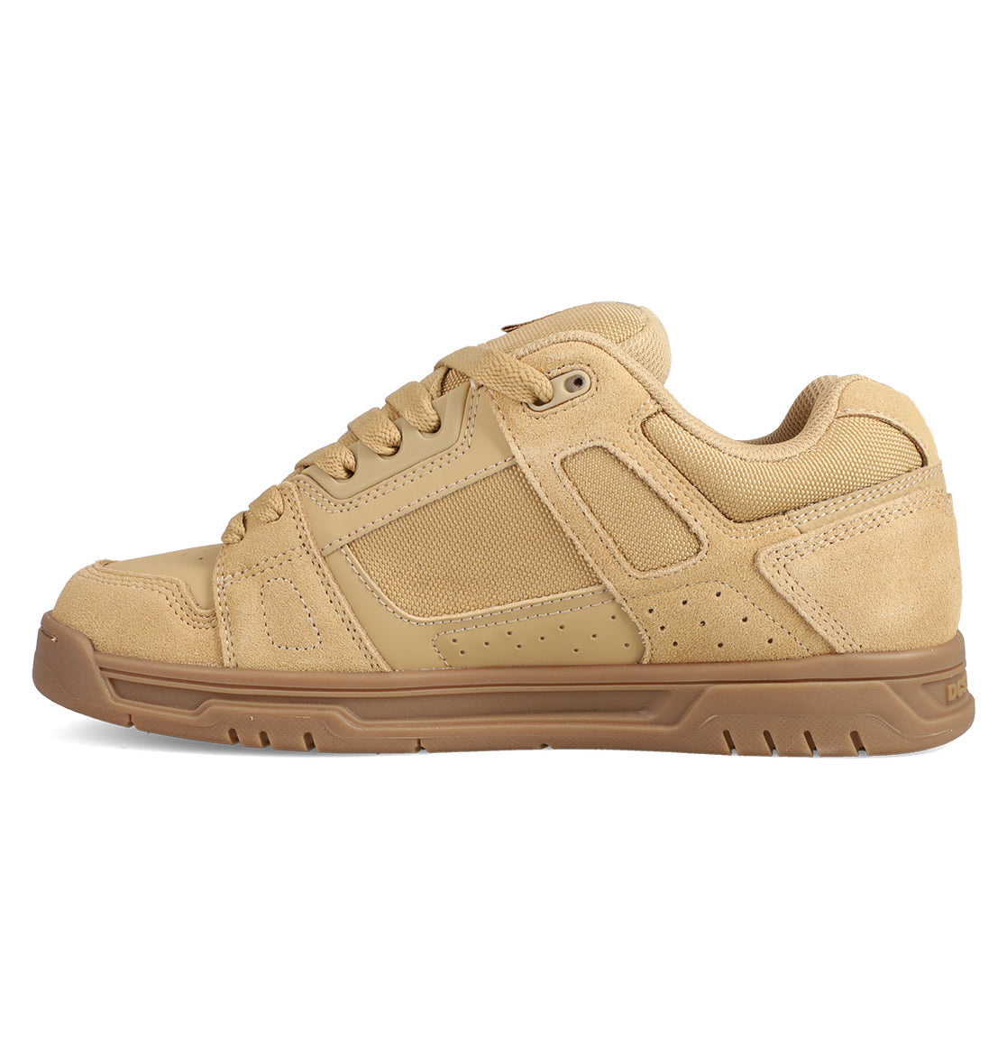 The Men's Stag Shoes by DC Shoes feature a tan skate-inspired design with a brown rubber cupsole, mesh and suede panels, visible stitching, and lace-up closure. Displayed in a left side profile view.