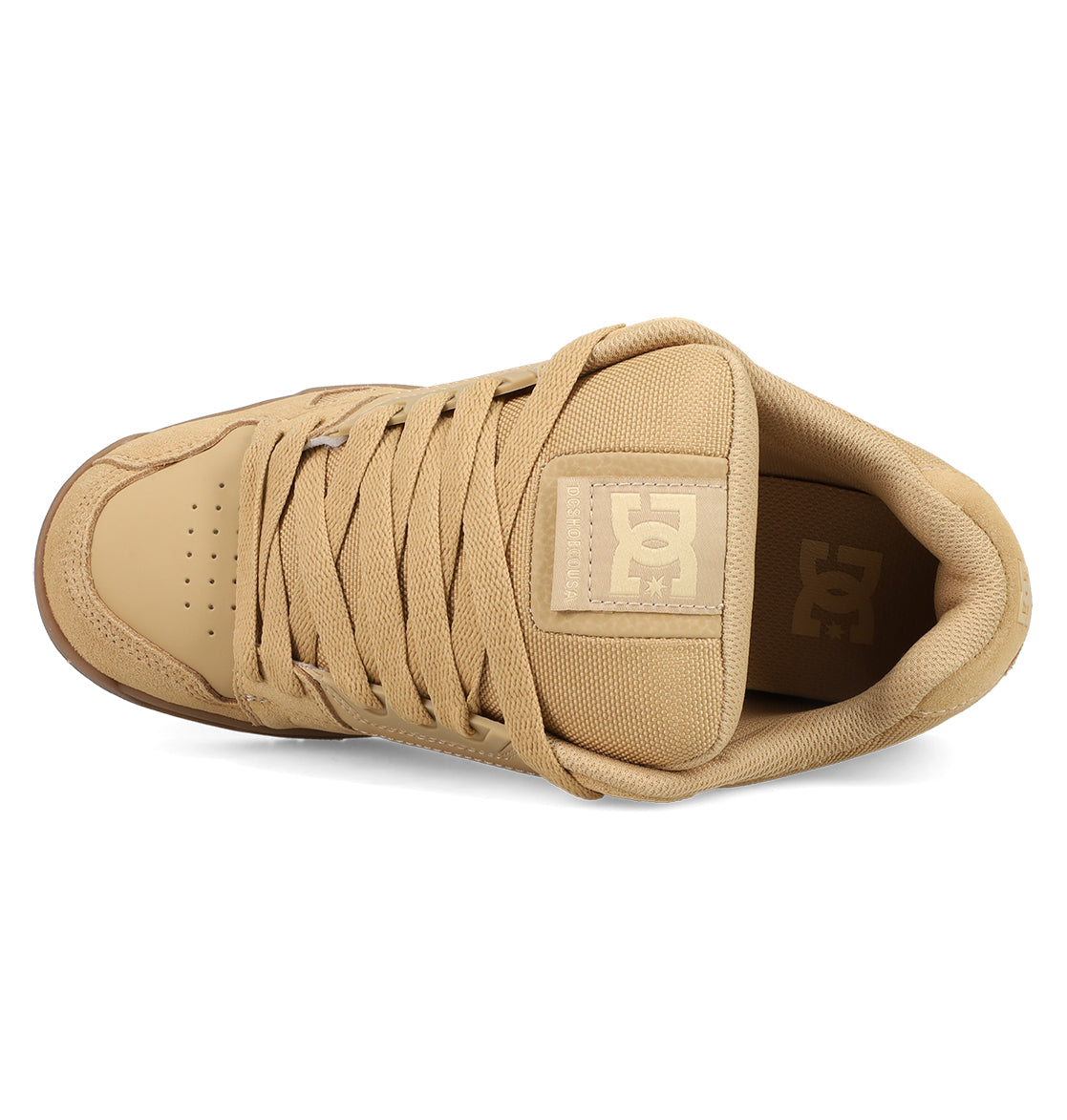 The DC Shoes Men's Stag Shoes in tan are shown from above, featuring matching laces, a padded tongue with the DC logo, cupsole construction, and toe perforations inspired by classic skate style.