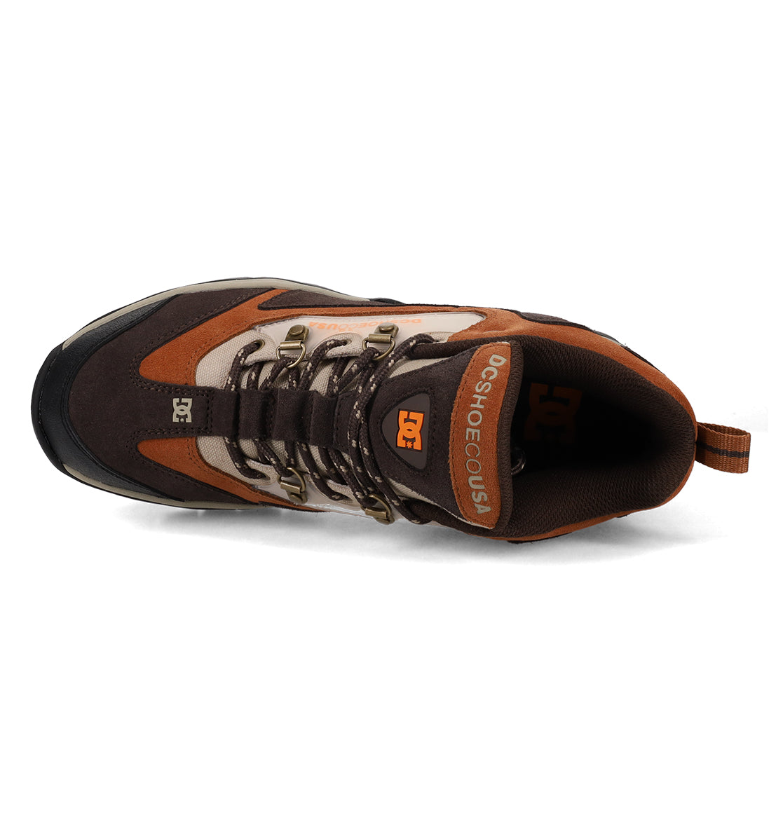Top view of the Men’s Recon OG Shoes by DC Shoes in brown, tan, and orange, featuring black laces, metal eyelets, and “DCSHOECOUSA” text on the tongue. This weather-resistant style also includes a heel pull tab for easy wear.
