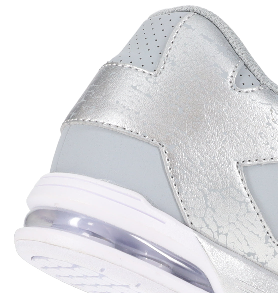 Close-up of the heel of the DC Shoes Women’s Command Shoes, showcasing signature cushioning in the sole and a textured, cracked pattern on the silver and gray metallic upper—bringing retro vibes to modern performance.