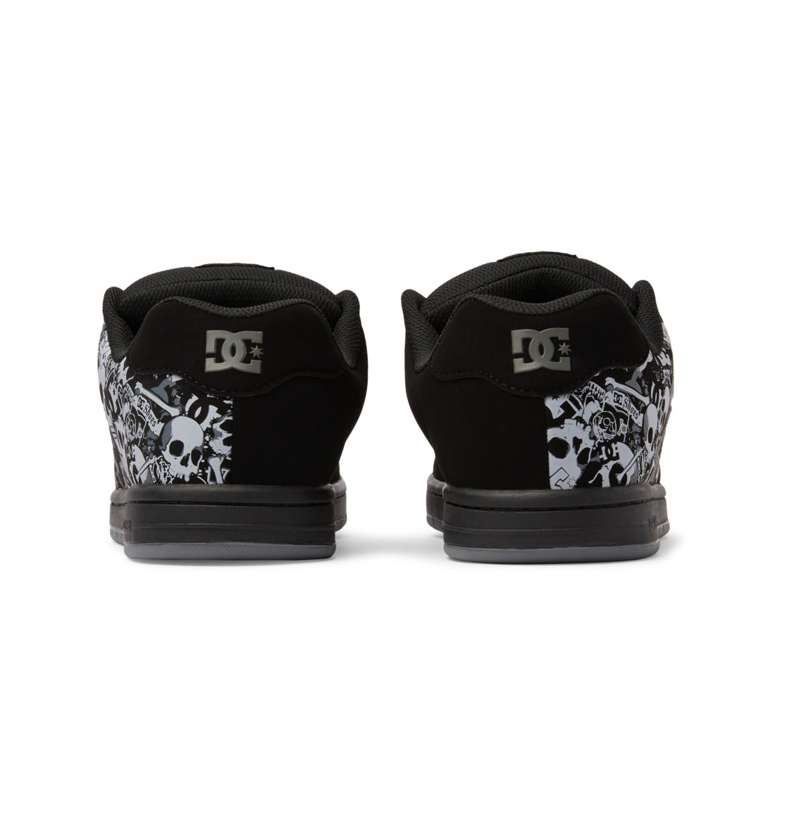 Back view of black Men’s Gaveler Shoes by DC Shoes, featuring durable leather construction, white and gray graphic skull designs near the heels, and the DC logo on the chunky heel tabs.