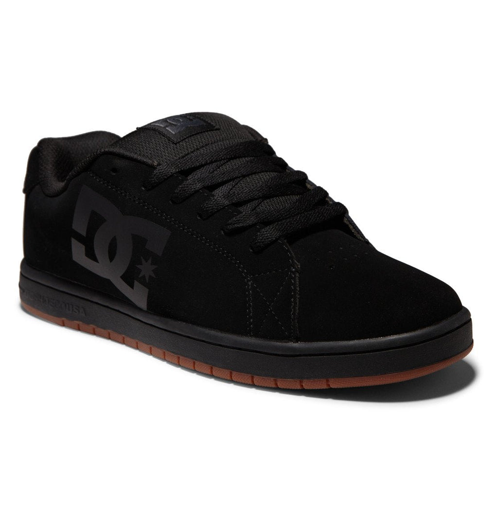 Introducing the Men’s Gaveler Shoes by DC Shoes—designed in sleek black with matching laces and sole. Featuring a prominent DC logo on the side, these chunky skate shoes include a brown rubber outsole for added grip. Crafted from durable leather, they offer long-lasting wear and reliable performance both on and off your board.