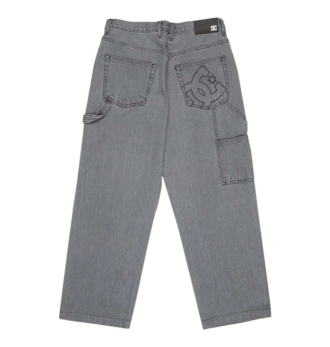 The Men's Baggy Denim Carpenter Pant by DC Shoes features heavyweight denim, a wide-leg fit, multiple pockets, a hammer loop, and a large DC Shoes logo embroidered on the right pocket.