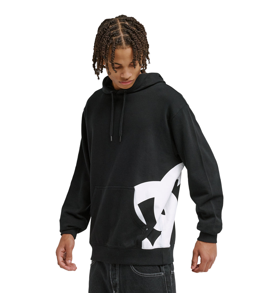 A person in a Reebok Lanai Ph black hoodie with a large white graphic on the lower side looks down while standing against a plain white background.